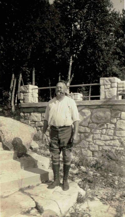 R.W. Peterson near his boathouse on White Cliff Road.